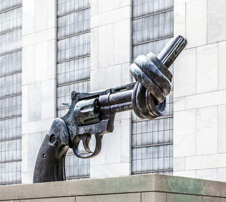NEW YORK, USA - JULY 12:  Gun tied in a knot outside UN headquarters as symbol for reaching peace, New York City on July 12,2010のeditorial素材
