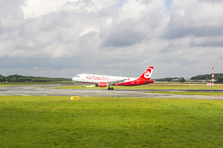 HAMBURG, GERMANY - AUGUST 5: An Air Berlin Airbus A319 lands on August 5, 2012 in Hamburg, Germany. Air Berlin is Germany's second largest airline with 35.3 million passengers in 2011.のeditorial素材
