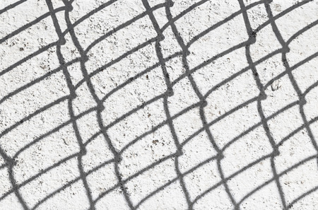 shadow of a fence at the wallの写真素材