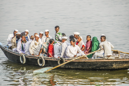 VARANASI, INDIA - DEC 11: people cross the river Ganges on a ferry on December 11, 2011 in Varanasi, India. Fwerry accidents costs more than 3000 lives in india yearly.のeditorial素材