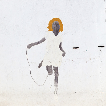 YAIZA, SPAIN - APRIL 2: murals at a white wall on April 2, 2012 in Yaiza, Spain. These murals were painted by  school children under supervision of the school.のeditorial素材