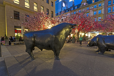 FRANKFURT, GERMANY - APRIL 4: Illuminated stock exchange with bull and bear at night on April 4, 2014 in Frankfurt, Germany. This festival Luminale takes place in Frankfurt every 2 years and lasts one week.のeditorial素材