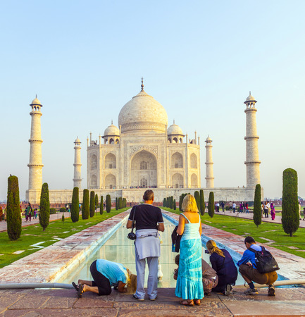 AGRA, INDIA - OCT 18: The people visit Taj Mahal, Agra, India on Oct 18, 2012. The Taj Mahal is a mausoleum located in Agra, India and is one of the most recognizable structures in the worldのeditorial素材