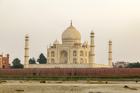 taj mahal from yamuna river in sunsetの写真素材