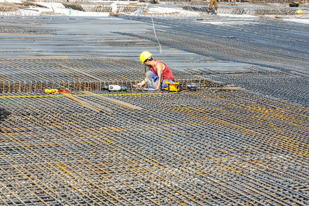 HOFHEIM, GERMANY - SEP 25  workers do the steel bars construction at a site on Sep 25, 2009 in...