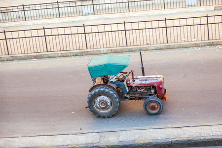 JAIPUR, INDIA - NOV 13, 2011: farmer on a tractor in the morning in Jaipur, India.   India ranks second worldwide in farm output. 50 % of the population are involved in agricultureのeditorial素材