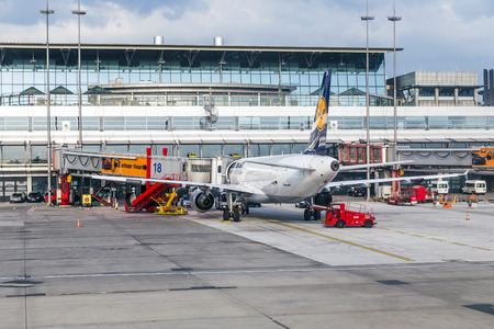 HAMBURG, GERMANY - MAY 22, 2014: Aircrafts at the gate in the modern Terminal 2  in Hamburg, Germany. Terminal 2 was completed in 1993 and houses Lufthansa and other Star Alliance partners.のeditorial素材
