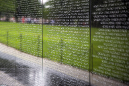 WASH DC -JULY 14: Names of Vietnam war casualties on Vietnam War Veterans Memorial on July 14,2010 in Washington DC, USA. Names in chronological order,from first casualty in 1959 to last in 1975.のeditorial素材