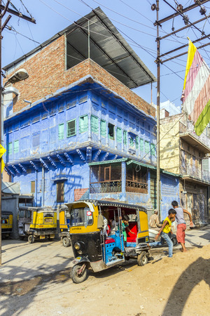 JODHPUR, INDIA - OCTOBER 23, 2012: Private auto rickshaw  three-weeler tuk-tuk taxi transports people in Jodhpur, India. Jodhpur is the second largest city in the Indian state of Rajasthan with over 1 million habitants.のeditorial素材