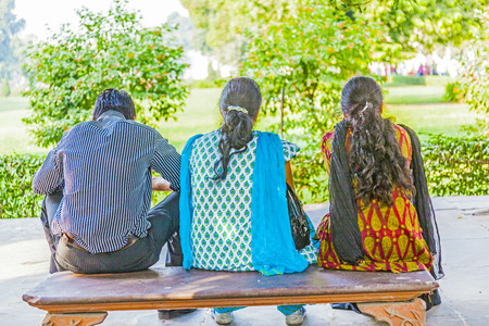 DELHI, INDIA - NOVEMBER 9, 2011  people visit the red Fort in Delhi, India and rest at a bench  Red Fort is a 17th century fort complex was designated a UNESCO World Heritage Site in 2007 のeditorial素材