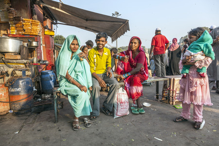 DELHI - NOVEMBER 8, 2011: women relax at a tea shop at the Meena Bazaar Market in Delhi, India. Shah Jahan founded the bazaar in the 17th century inspired by the architecture of the Isfahan Bazaar.のeditorial素材