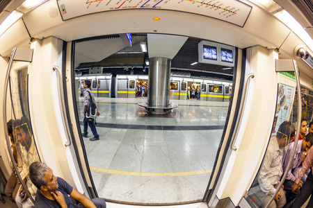 DELHI, INDIA - NOV 10, 2011: people in the train at the metro station  in Delhi, India. It is one of...
