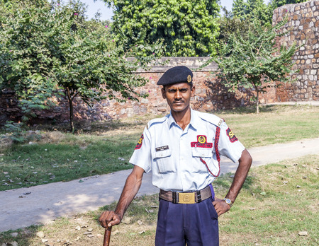 DELHI, INDIA - NOV 11, 2011: guard in the garden of  Humayun's tomb, built by Hamida Banu Begun in 1565-72 A.D. in Delhi, India. The earliest example of Persian influence in Indian architecture.のeditorial素材