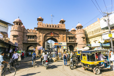 BIKANER, INDIA - OCT 24, 2012: people at the old city gate in Bikaner, India. The Kote gate was closed after sunset till sunrise during reign of Maharajah Ganga Singh.のeditorial素材