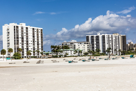 FORT MYERS, USA - JULY 27, 2013: Unknown people on a beach in Fort Myers, USA. Fort Myers first became a nationally known winter resort with the building of the Royal Palm Hotel in 1898.のeditorial素材