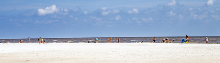 FORT MYERS BEACH, USA - JULY 27, 2013: Unknown people on a beach in Fort Myers Beach, USA. As of the census[  of 2010, there were 6,277 people in 3,444 households residing in the town.のeditorial素材