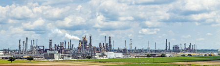 SAINT JAMES, USA - JULY 14, 2013: Smokestacks spewing smoke from  oil refinery in Saint James, USA....