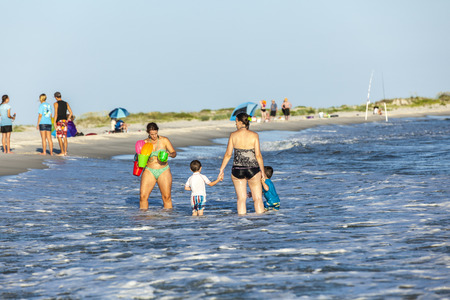 DAUPHIN ISLAND, USA - JULY 17, 2013: people enjoy the beautiful beach in late afternoon  at Dauphin Island, USA.のeditorial素材