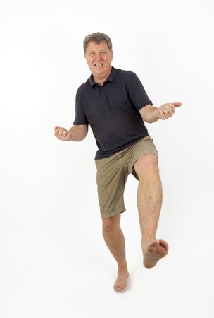 Full Length Portrait of  Confident Barefoot Man in Blue Jeansの写真素材