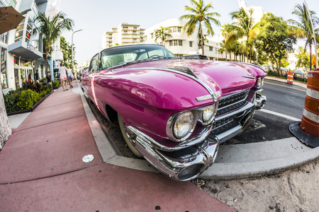 MIAMI, USA - AUG 18, 2014 : Cadillac Vintage car parked at Ocean Drive in Miami Beach, Florida. Art...