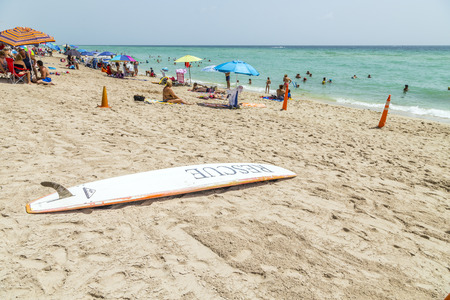 SUNNY ISLES BEACH, USA - AUG 17, 2014: people enjoy and relax near the pier in Sunny Isles Beach, USA. In 1936, Milwaukee malt magnate Kurtis built the Sunny Isles beach and pier.のeditorial素材