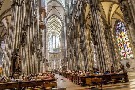 COLOGNE, GERMANY- SEP 7, 2014: church service held in the cathedral in Cologne, Germany. The dome is Germanys most visited landmark visited by 20.000 people a day.のeditorial素材