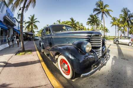 MIAMI, USA - AUG 19, 2014: classic Oldsmobile parks in front of the Hotel Park Central in Miami, USA. Built in 1937, The Park Central is known as The Blue Jewel of Ocean Drive.のeditorial素材