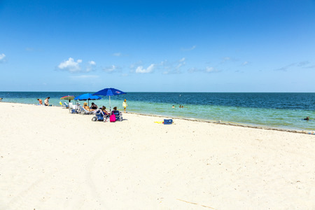MIAMI, USA - AUG 22, 2014: People relax at the Crandon Park beach in Miami, USA. The park is more than 800 acres in size, and has two miles  of beach on the Atlantic Ocean side.のeditorial素材