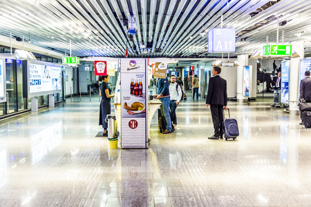 FRANKFURT, GERMANY-SEP 18, 2014: passengers at the departure hall in Frankfurt, Germany. With 38 million passengers per year it is one of the most important airport in Europe.のeditorial素材