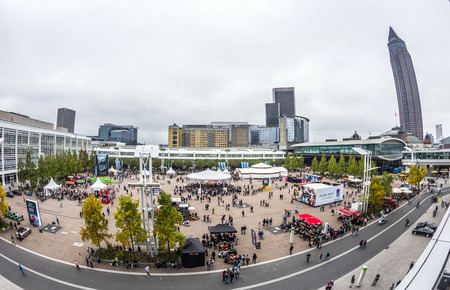 FRANKFURT, GERMANY - OCT 12, 2014 : public day for Frankfurt Book fair, visitors inat the great place with reading tent in Frankfurt, Germany. The fair is open at the weekend for public.のeditorial素材
