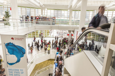 FRANKFURT, GERMANY - OCT 12, 2014 : public day for Frankfurt Book fair, visitors inside the hall in Frankfurt, Germany. The fair is open at the weekend for public.のeditorial素材