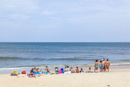 BUXTON, USA - JULY 18, 2010: people enjoy the beach at Buxton, USA. Buxton is a small village at Hatteras Island and often endangered by hurricanes.のeditorial素材