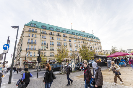 BERLIN, GERMANY -OCT 27, 2014: people walk in front of Hotel Adlon at the, Pariser Platz, Berlin, Germany. Adlon is the most famous and luxury hotel in Berlin.のeditorial素材