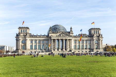 BERLIN, GERMANY - OCT 27, 2014: Tourists walk along Reichstag area in Berlin, Germany. More than 25 million people visit the city every year.のeditorial素材