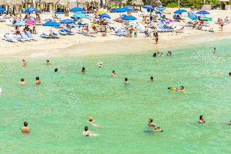 SUNNY ISLES BEACH, USA - AUG 2014: people at Jade beach in Sunny Isles Beach, USA. Jade Beach and Ocean were completed in 2009.のeditorial素材