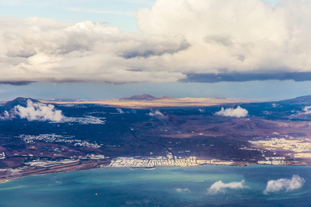 aerial of Lanzarote with volcanoes in cloudsの写真素材