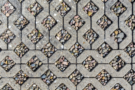 background of concrete stones with pebble stones inlayの写真素材