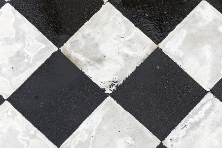 black and white pattern od squares at the street for pedestrian crossing