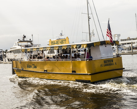 FORT LAUDERDALE, USA - AUGUST 20, 2014 : people travel in Water taxi in Fort Lauderdale, USA. Water taxi is popular by local people as well as by tourists.のeditorial素材