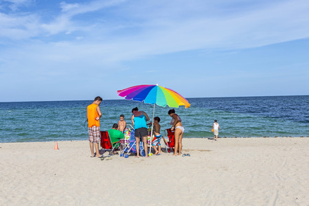 SUNNY ISLES BEACH, USA - AUG 17, 2014: people relax near the pier in Sunny Isles Beach, USA. In 1936, Milwaukee malt magnate Kurtis built the Sunny Isles beach and pier.のeditorial素材
