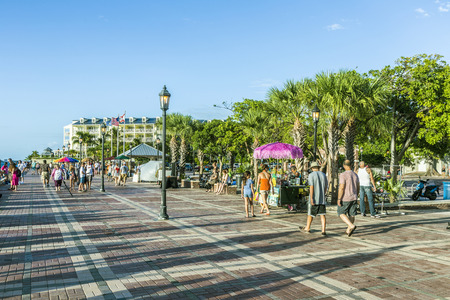 KEY WEST, USA - AUG 26, 2014: people enjoy the sunset point at Mallory square in Key West, USA. This place is the most popular sunset point in Key West.のeditorial素材
