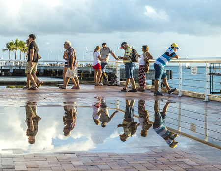 KEY WEST, USA - AUG 26, 2014: people enjoy the sunset point at Mallory square in Key West, USA. This place is the most popular sunset point in Key West.のeditorial素材