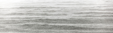 beach in heavy rain over the pacific oceanの写真素材