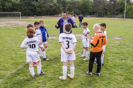 NIEDERJOSBACH, GERMANY - MAY 8, 2008: trainer discusses the Football game Children E-Class Niederjosbach - BSC Schwalbach in Niederjosbach, Germany.  Schwalbach wins 2:1.のeditorial素材