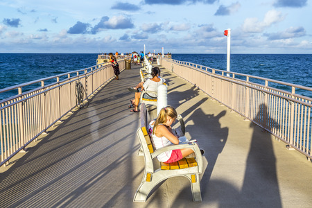 SUNNY ISLES BEACH, USA - AUG 1, 2013: people enjoy the Fishing Pier in Sunny Isles Beach , Florida. It is the only public fishing pier in Miami-Dade County.のeditorial素材