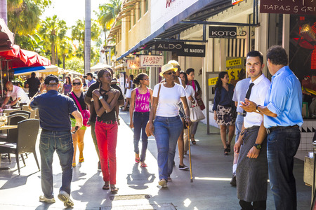 MIAMI, USA - AUG 1, 2013: people go shopping in the afternoon sun in Lincoln Road, Miami, USA. Lincoln Road Mall is a pedestrian-only promenade and the epicenter of whats happening in South Beach.のeditorial素材