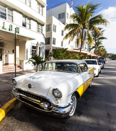 MIAMI BEACH, USA - AUG 5, 2013: classic Oldsmobile with chrome radiator grill parked in front of the restaurant in Hotel Avalon in Miami Beach, USA.のeditorial素材