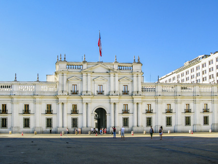SANTIAGO, CHILE - JAN 25, 2015: people visit the Palacio de la Moneda in Santiago, Chile. The palace was opened in 1805 as a colonial mint, but later became the presidential palace.のeditorial素材