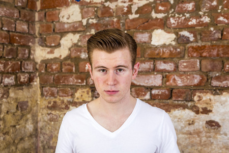 portrait of cute teenage boy with red hairの写真素材