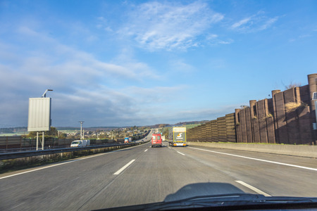 MOGENDORF, GERMANY - NOV 6, 2014: driving the highway A3 early morning direction Cologne at Mogendorf, Germany. The A3 was build from 1931 to 1943.のeditorial素材